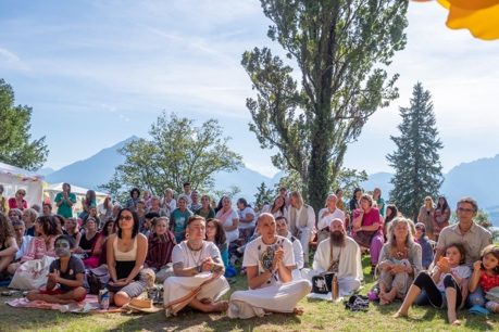 Families gathered outdoors at the ashram