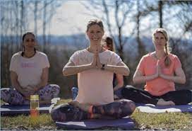 Group meditation outdoors at the ashram